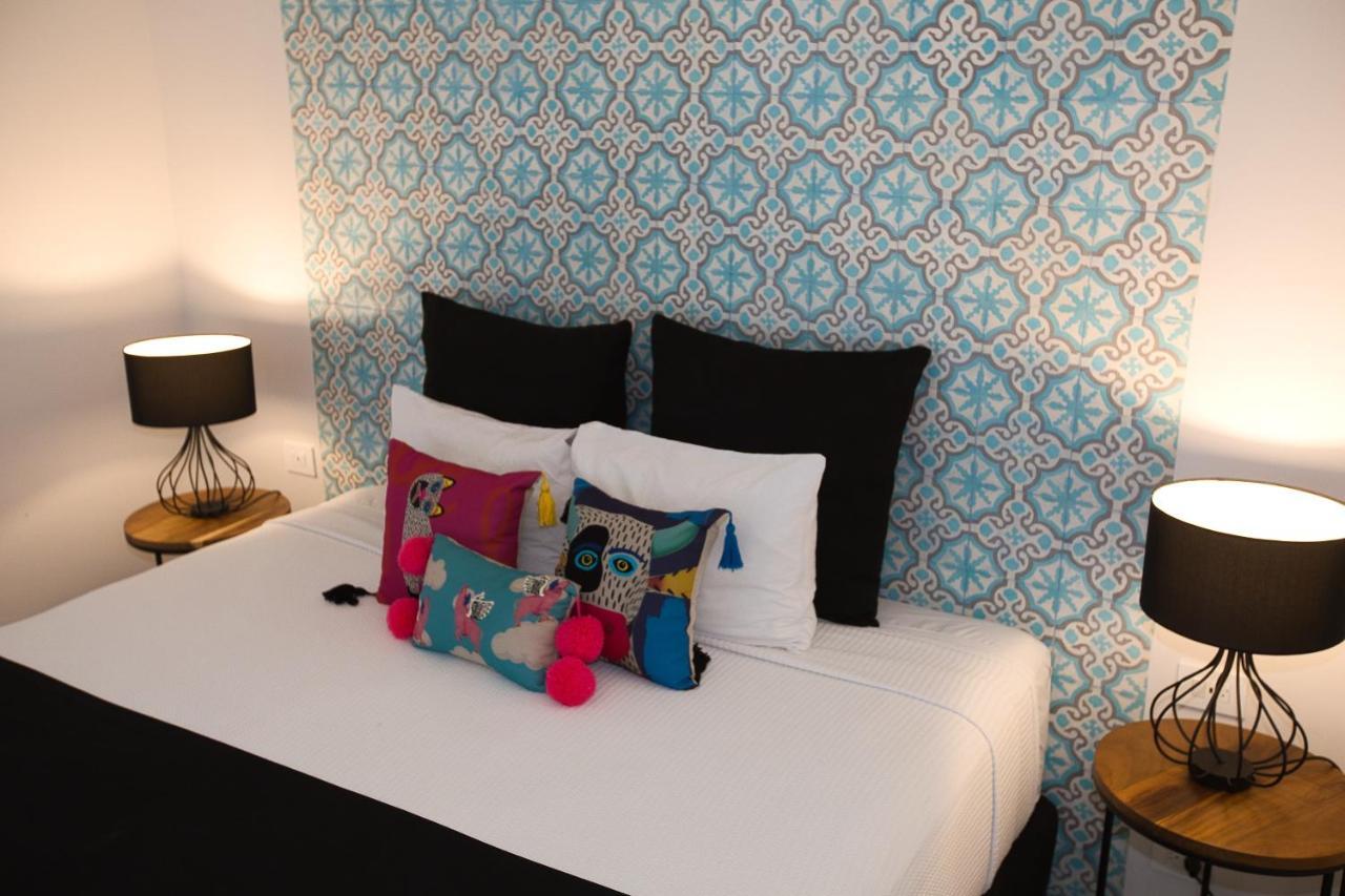 Hotel Casa Chukum Bacalar Exterior foto A bed with cushions