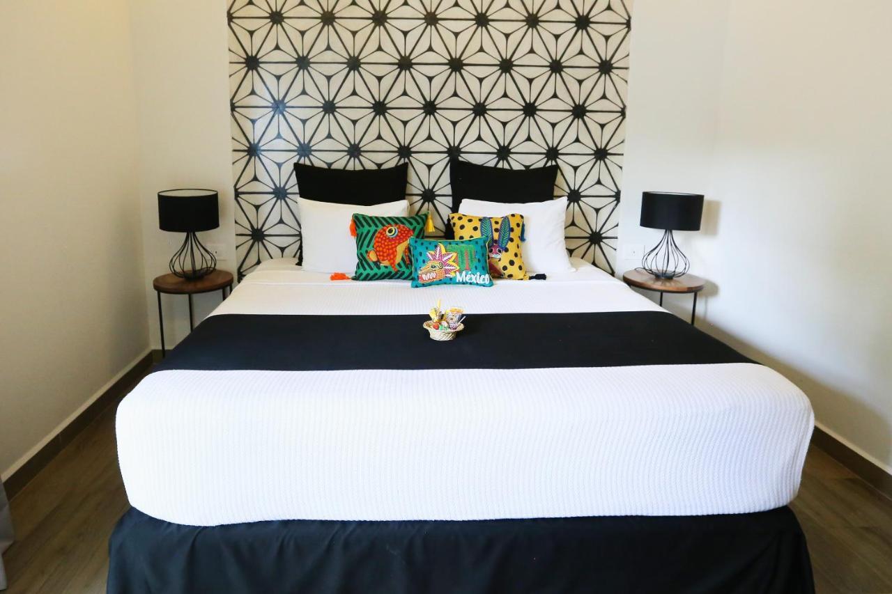 Hotel Casa Chukum Bacalar Exterior foto A bed with a bed runner